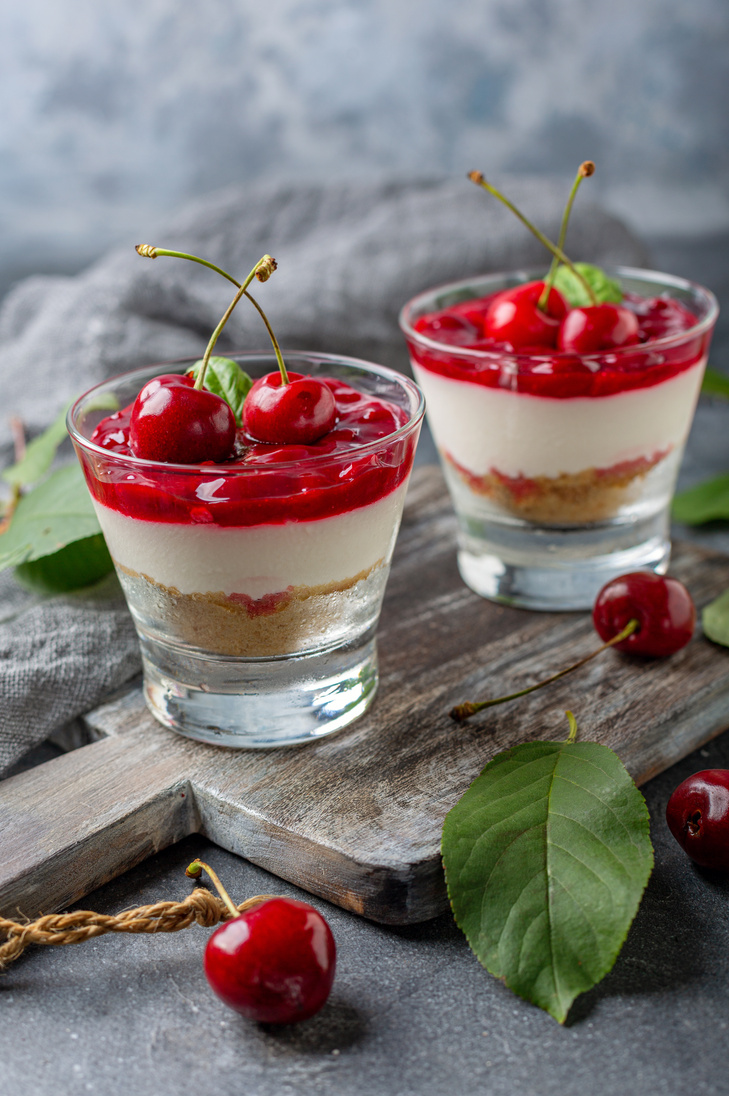 Sweet cherry cheesecake in glasses.